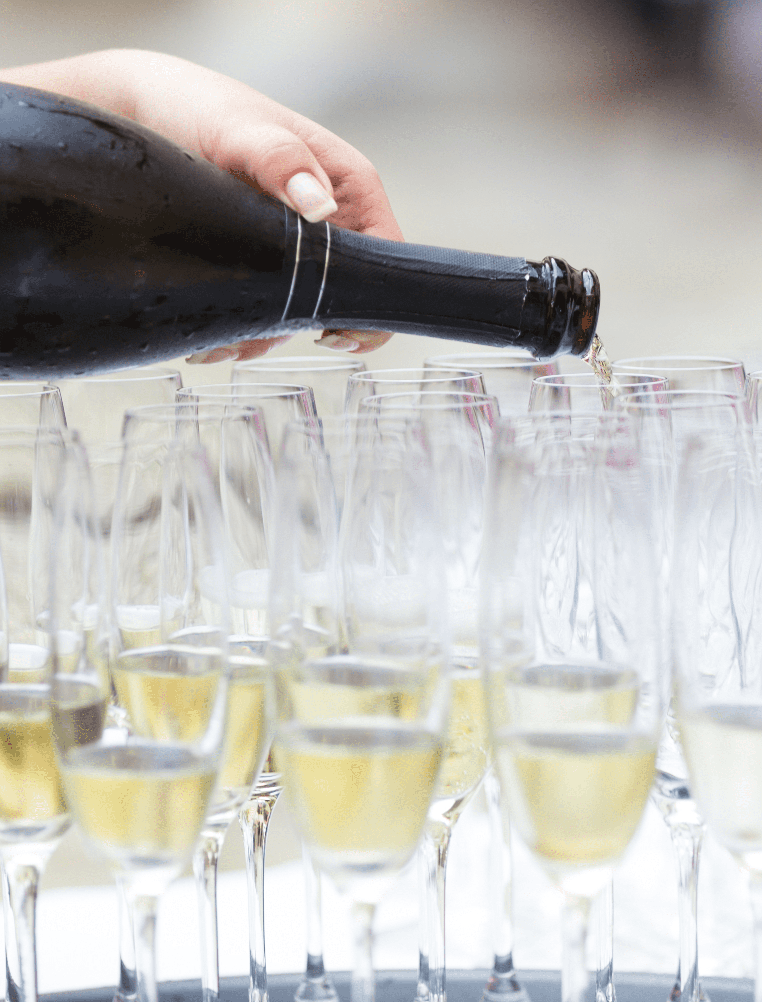 Pouring Champagne into Multiple Glasses
