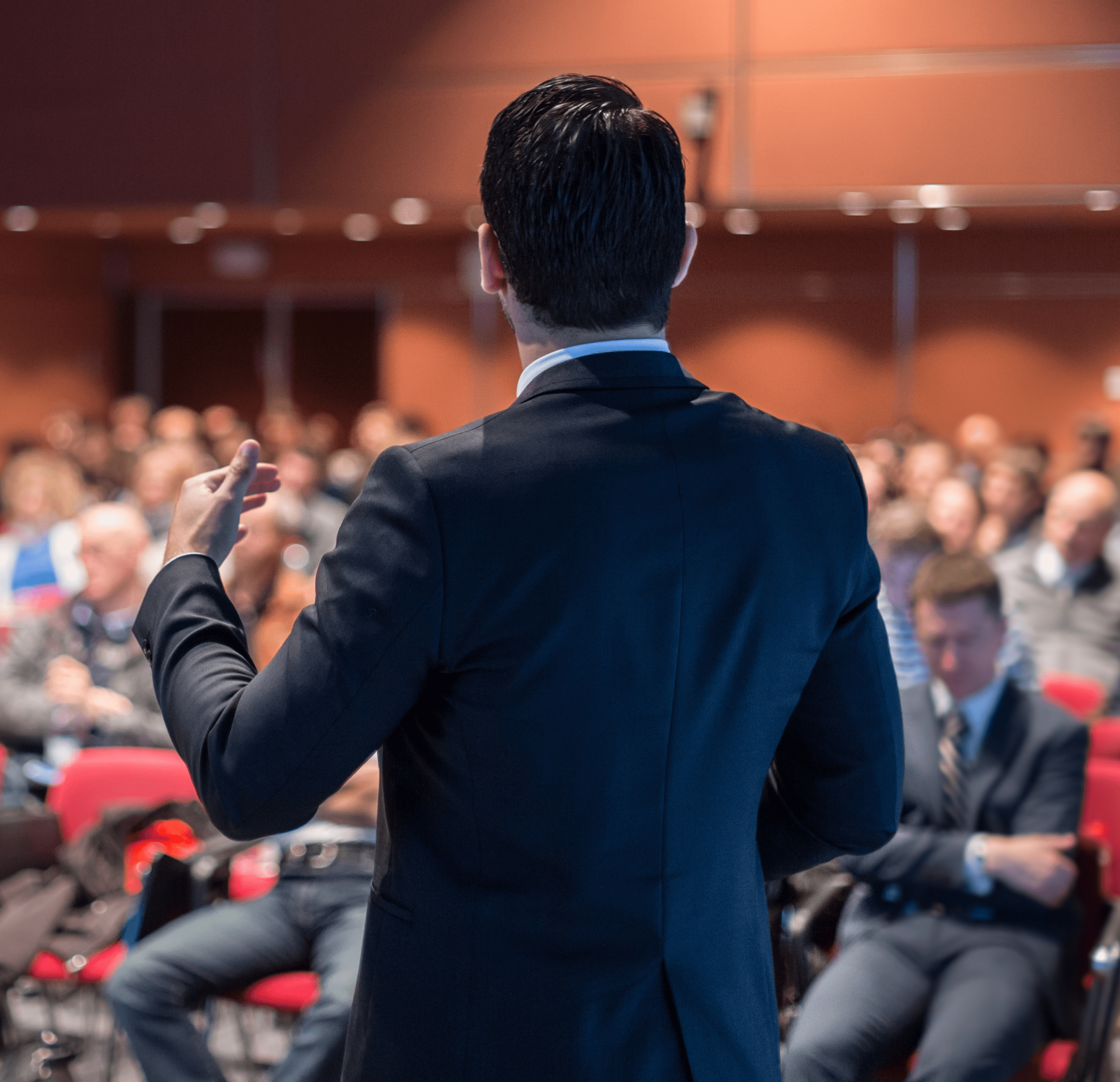Back View of a Speaker at Business Conference