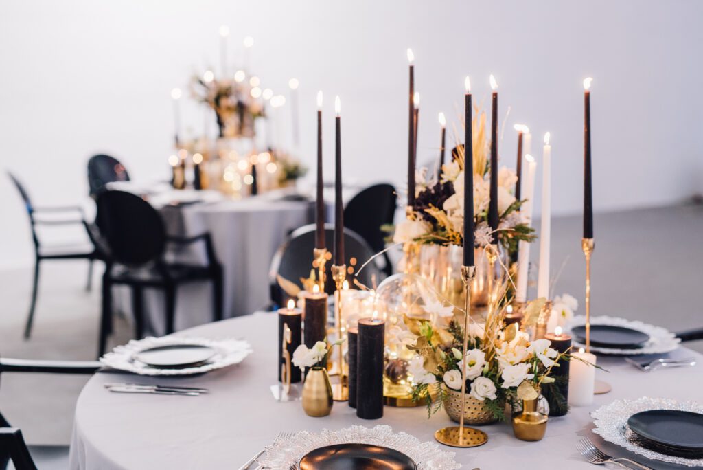 Black Candles with Flowers on a Wedding Decor Table